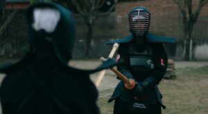 Two Kendo martial artists engaged in mock combat